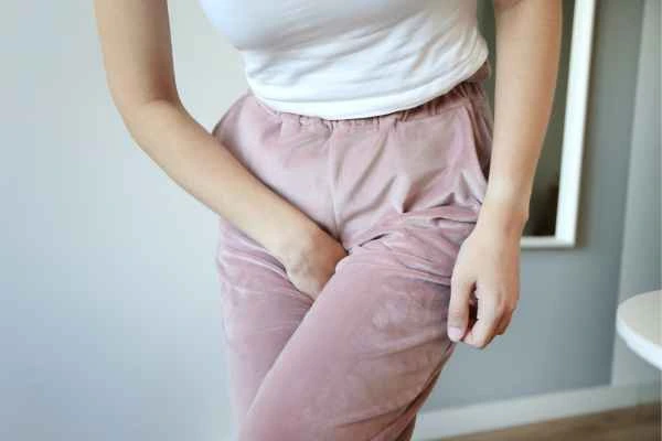 woman struggling with urine incontinence Acton Green